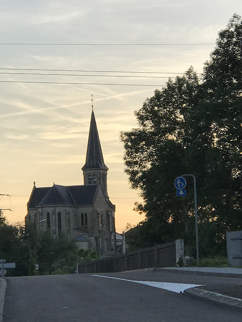 Sun sets behind the church in Roches-sur-Marne
